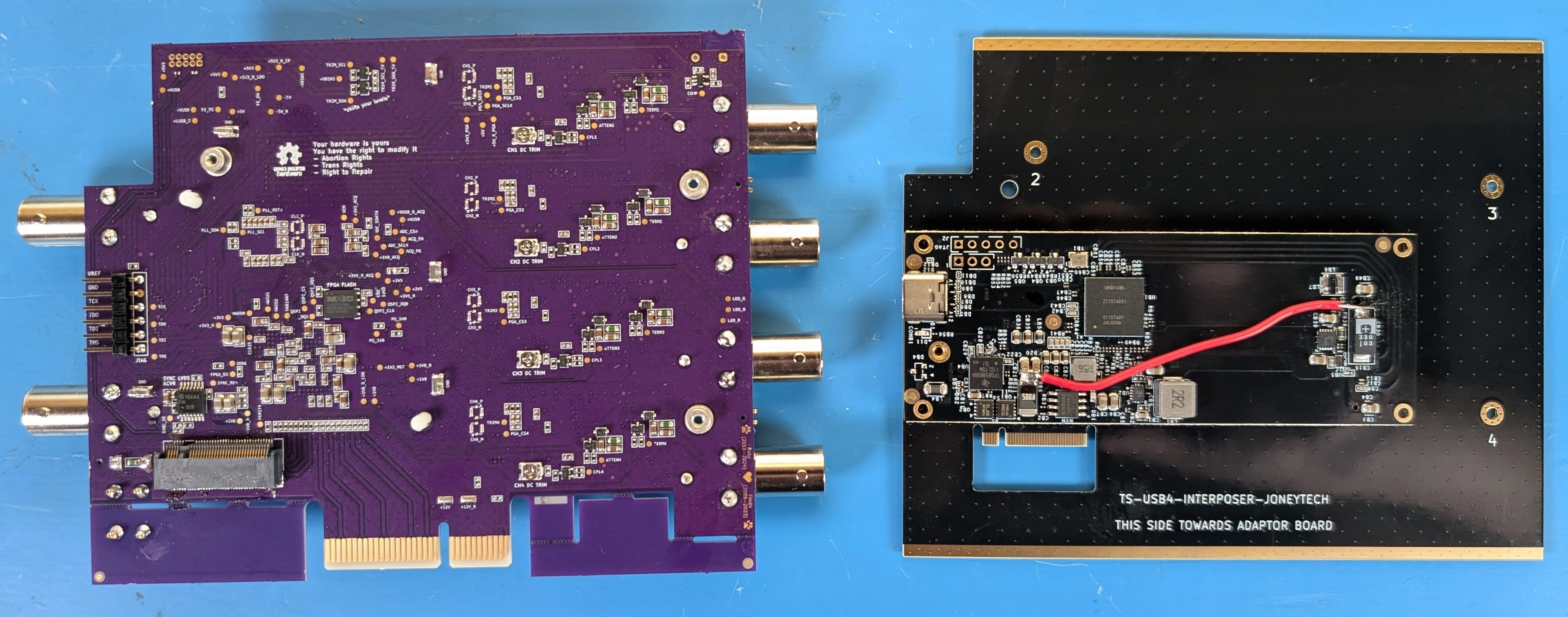 A TS-USB4 variant mainboard (left) and a JoneyTech interposer with adaptor installed.